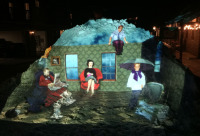 Acadian Nights projected onto snow bank downtown Telluride.